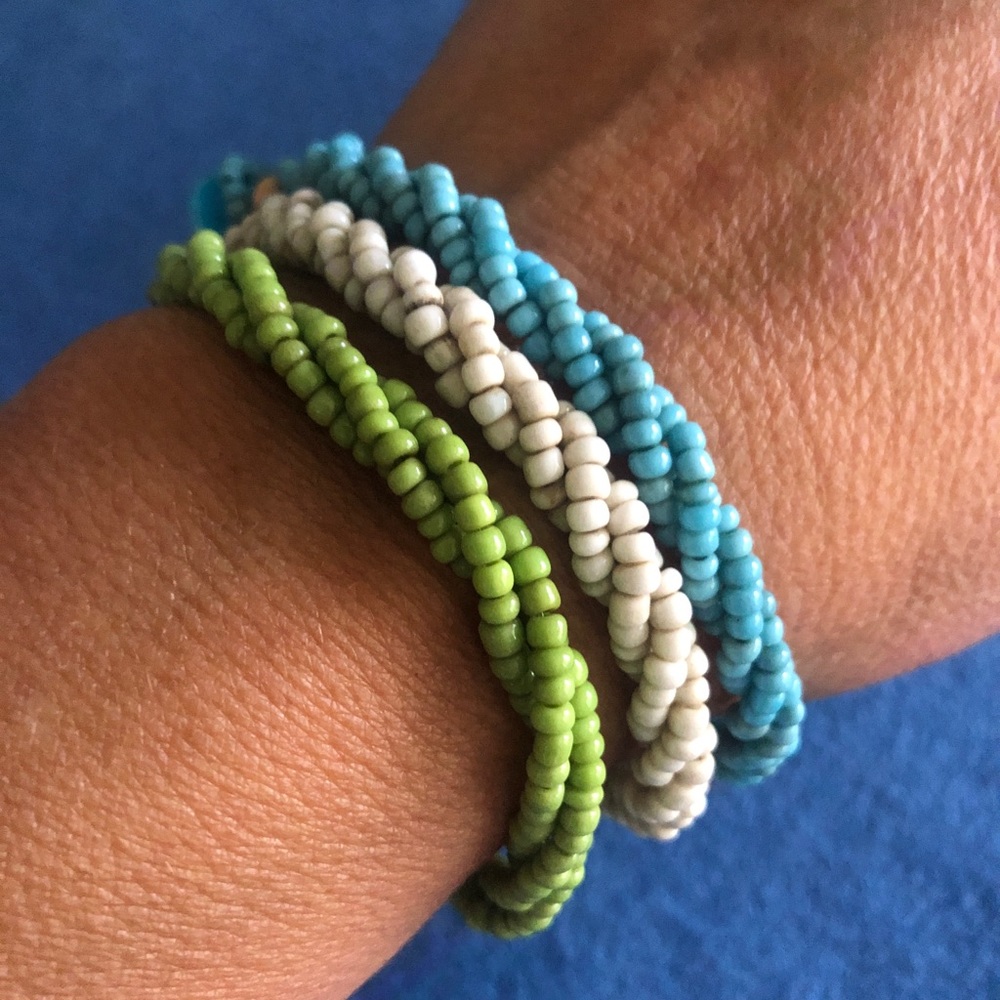 Set of three beaded bracelets made by About Color. NWT